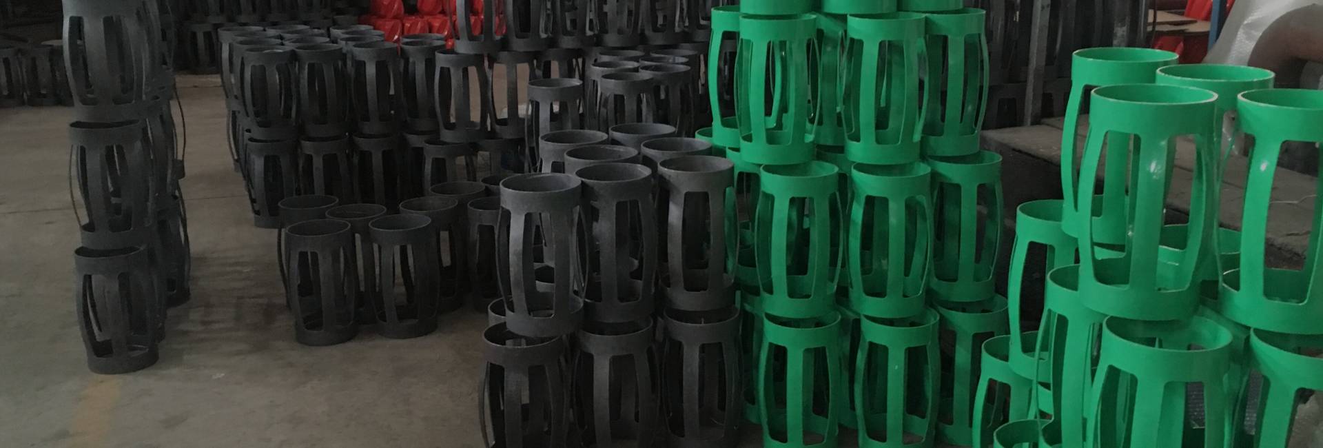 Several coated and uncoated cementing casing centralizers in the warehouse.