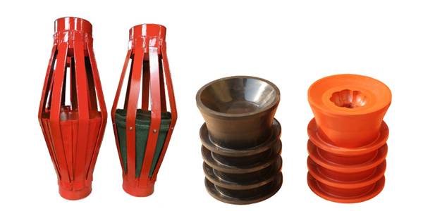 Several cementing plugs and baskets on white background.