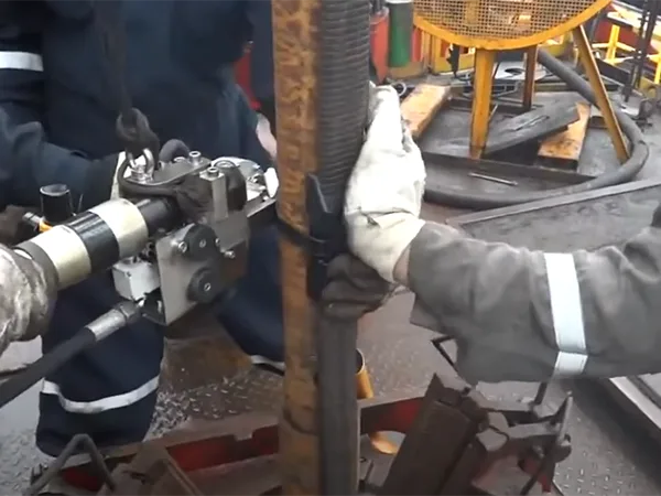 Workers are installing ESP cable protector.