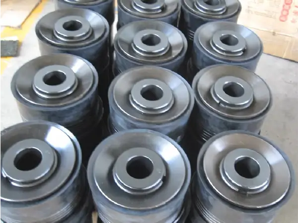 Neatly arranged black mud pump rubber pistons