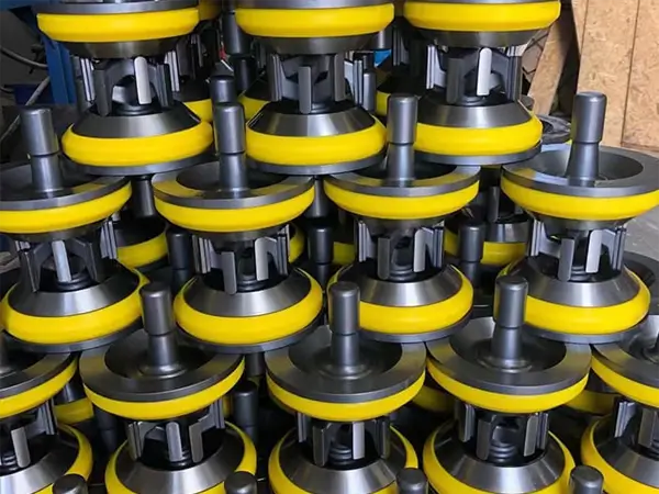 Neatly stacked mud pump valves and seats