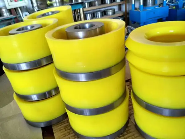 Neatly stacked yellow polyurethane bonded pistons