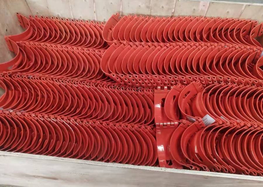 Several hinged stop collars in the wooden cases.